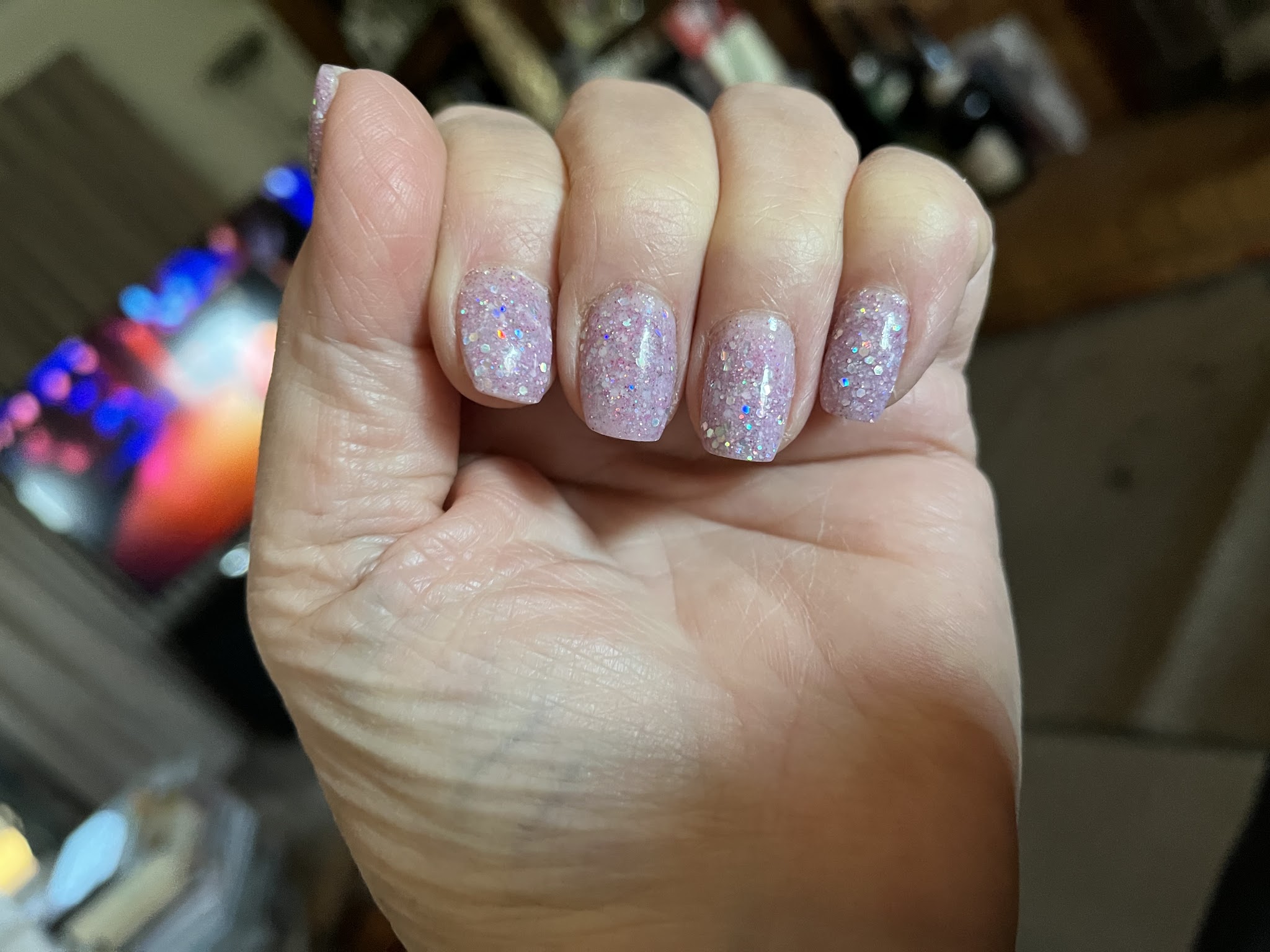 Pink glitter nails finished at Le Belle Beauty